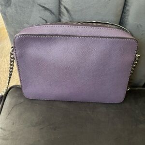 Purple and silver crossbody bags, has small stains on inside